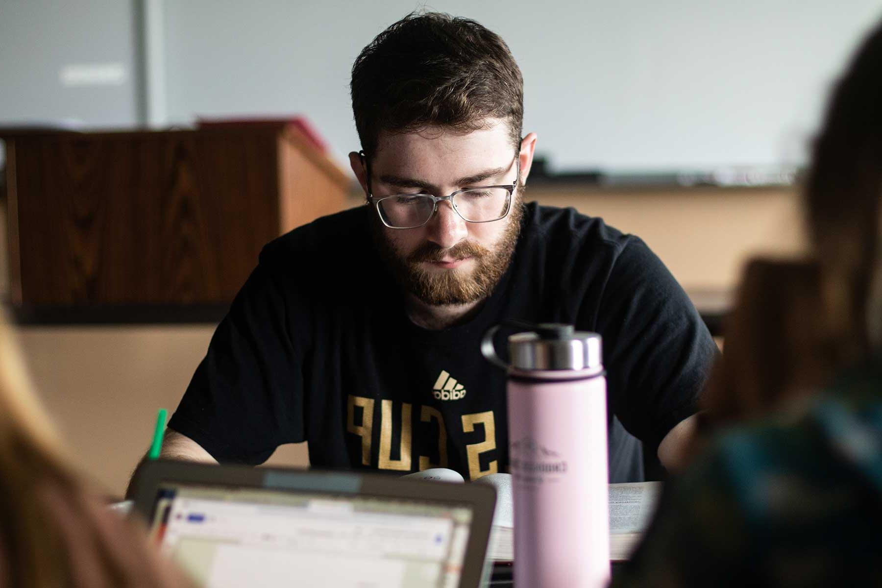 male student studying